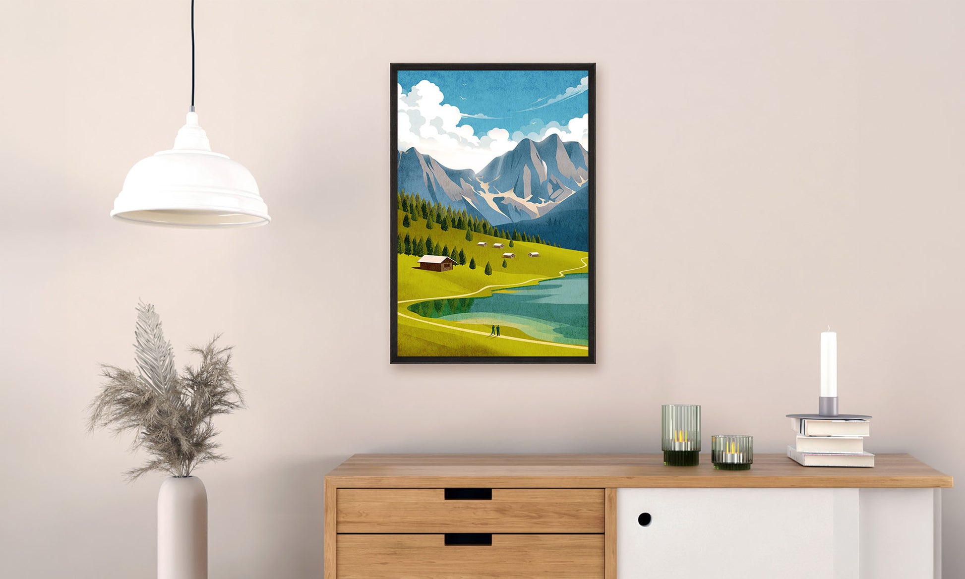 Framed artwork of a mountain landscape hanging on a wall above a wooden cabinet.