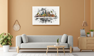 A framed watercolor art print of Angkor Wat, Cambodia, displayed on a warm beige wall above a modern light gray sofa in a styled living room setting.
