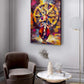 A colorful abstract canvas print of a dancer in front of a wheel hangs on a light gray wall in a modern living room setting with a brown armchair, marble coffee table, and floor lamp.
