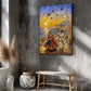 A colorful canvas wall art print depicting a festive outdoor scene with dancing figures, a temple, and flying kites, displayed on a textured gray wall above a wooden bench in a styled interior.