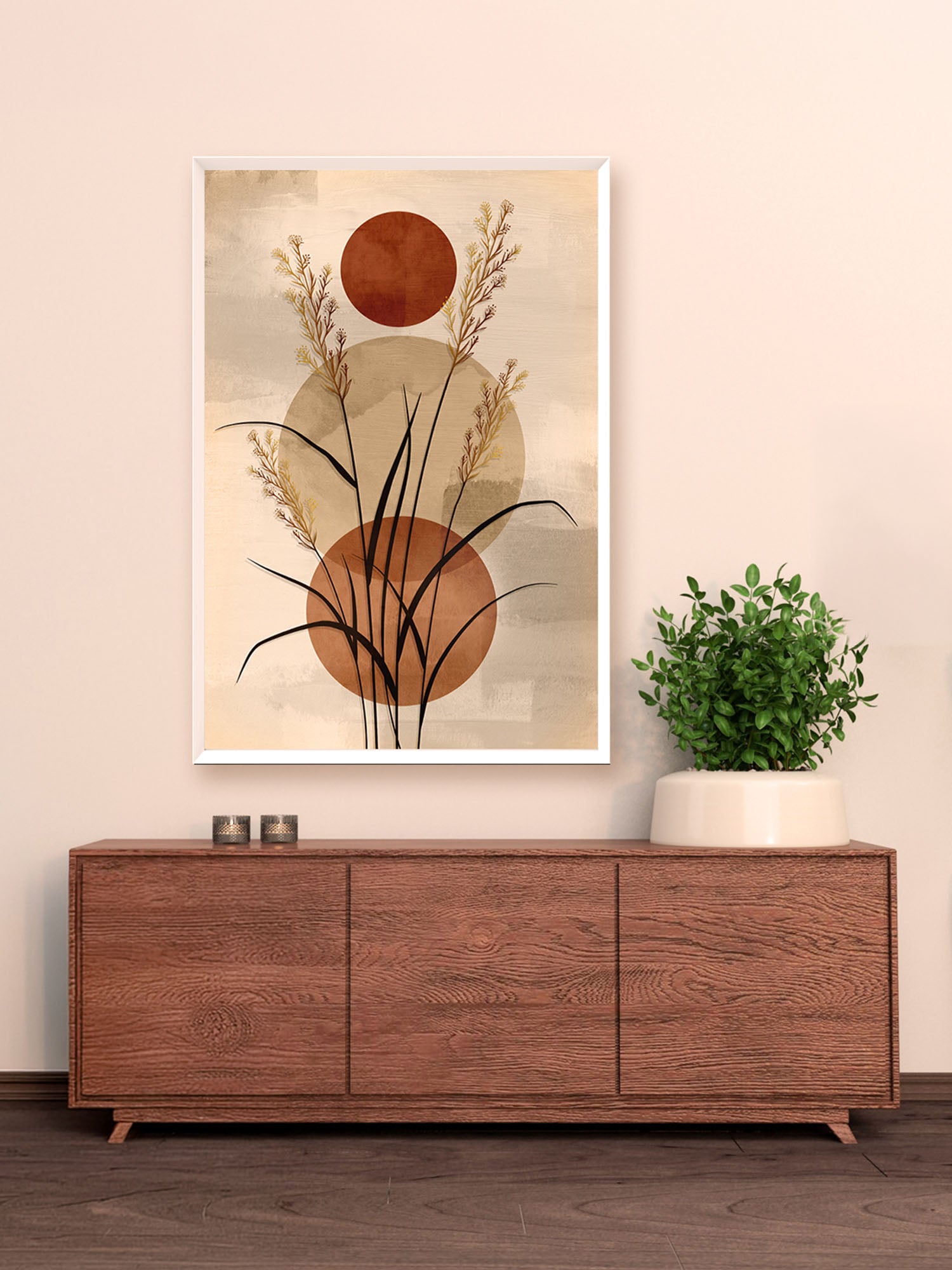 Framed abstract art piece on a wall above a wooden cabinet with a plant.