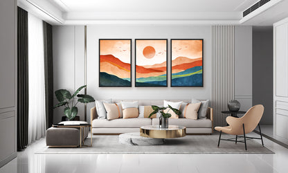 Modern living room with a gray sofa, coffee table, and wall art depicting a sunset.