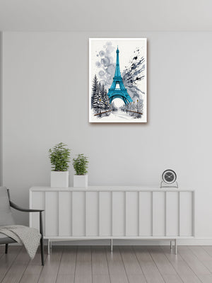 A vertical framed wall art print featuring a blue and white watercolor-style Eiffel Tower scene, displayed above a white sideboard in a modern room with two potted plants and a small clock.