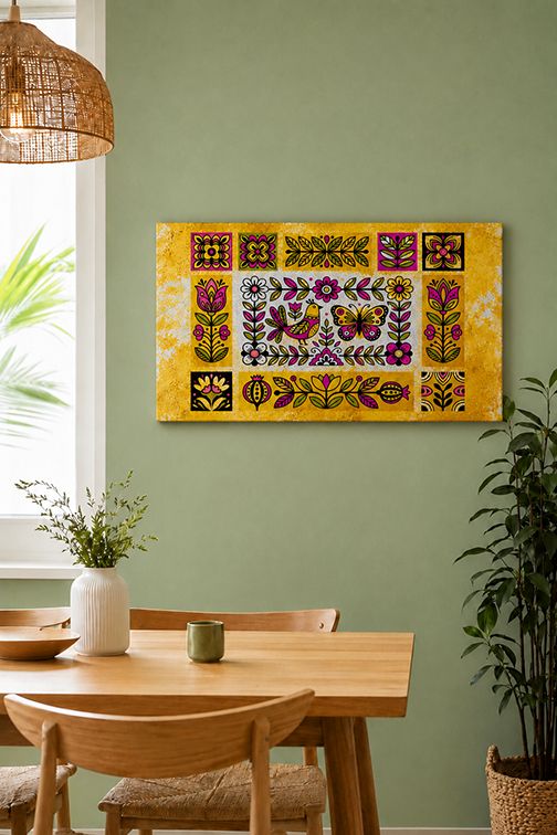 A coloruful rectangular wall art piece with a yellow background and intricate floral and butterfly patterns, displayed on a sage green wall above a wooden dining table in a styled room.