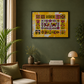 A framed colorful folk-art print with a yellow background hangs on a dark green wall in a styled living room with a wicker chair, sideboard, lamp, and plants.