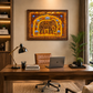 A framed wall art print featuring a golden elephant illustration hangs above a wooden desk in a modern home office setting with a leather chair, laptop, lamp, and plants.