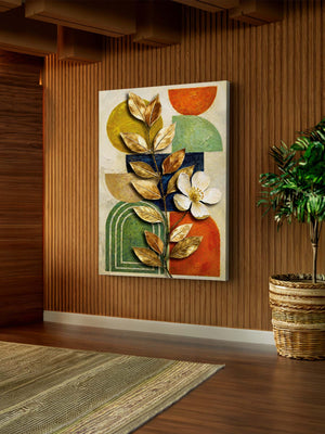 Decorative leaf wall art with floral design on a wooden wall, next to a plant.