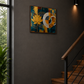A square abstract wall art print featuring a yellow lotus flower and a white circular motif on a blue and gold background, displayed on a dark grey wall in a modern staircase hallway.
