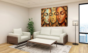 Living room with a white sofa, armchair, coffee table, and decorative wall art.Harmony of Three contemporary figurative canvas wall art featuring three serene feminine faces with earthy tones and nature-inspired leaf motifs