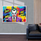Colorful 'The Joker' poster on a wall above a dark gray armchair.