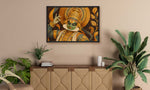 A framed wall art print depicting a stylized figure in ornate gold and green attire, hung above a wooden cabinet in a styled interior with plants and candles.