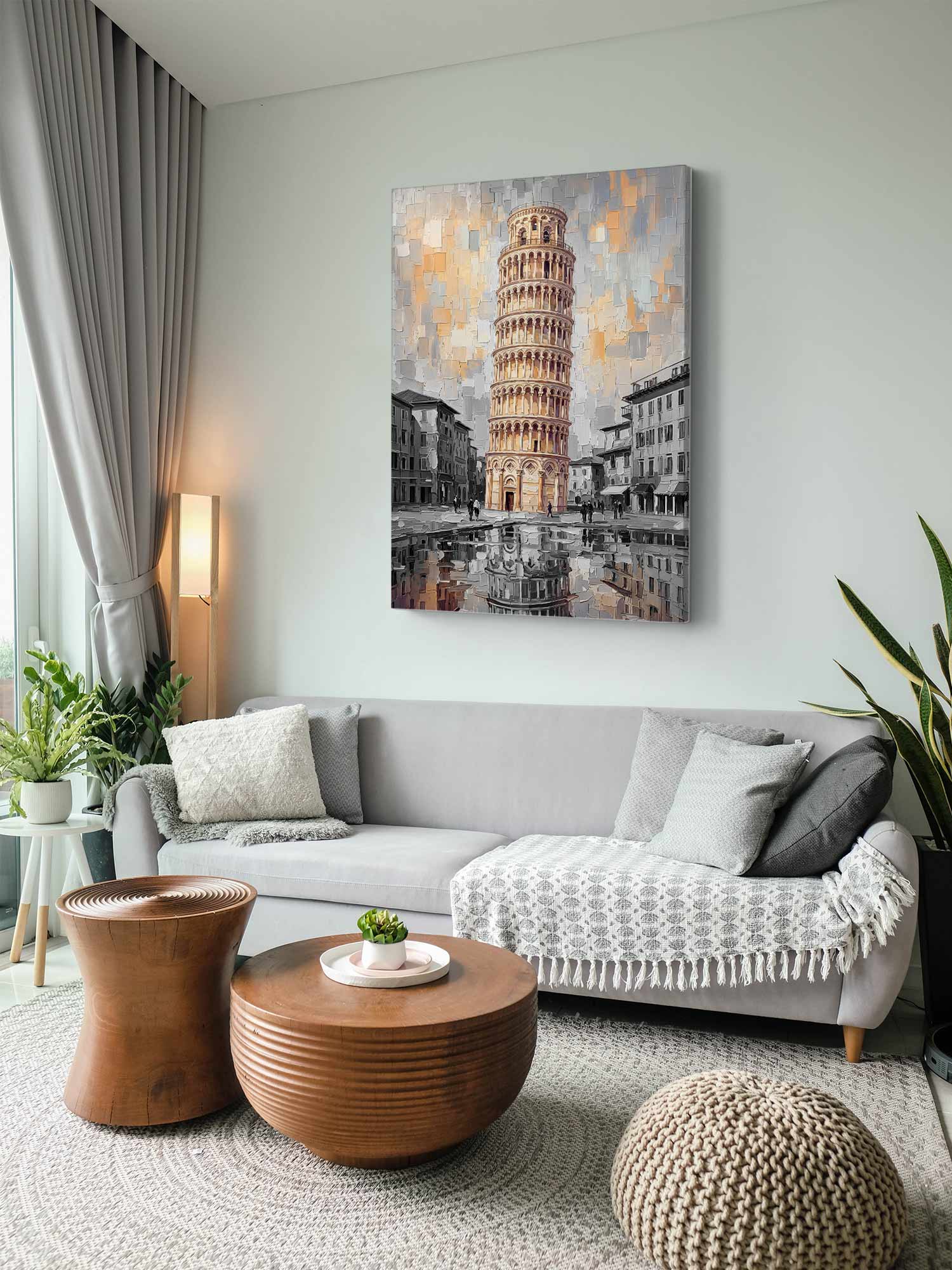 A rectangular canvas wall art print depicting the Leaning Tower of Pisa in an urban scene, styled in a modern living room above a light gray sofa.