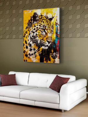 Leopard painting on a wall above a white sofa with red pillows.