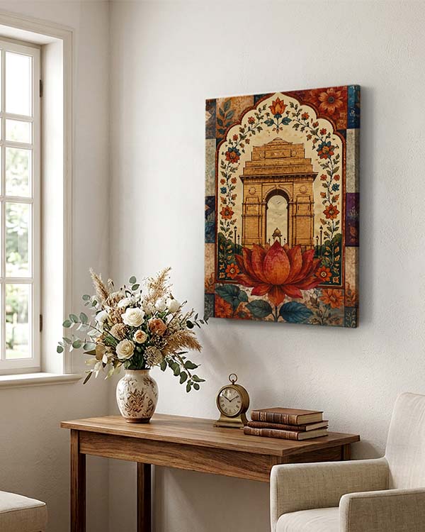 A vertical canvas wall art print depicting a traditional Indian architectural archway with a large red lotus flower, displayed in a styled room above a wooden console table with a vase of flowers and a small clock.