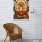 A framed art print featuring a traditional Indian architectural archway with a large red lotus flower, displayed on a white brick wall above a wicker chair and next to a white floor lamp.