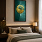 A framed wall art print featuring a stylized lotus flower in teal and gold tones, displayed above a bed in a modern, warmly lit bedroom.