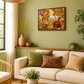 A styled living room scene with a cream sofa, patterned throw pillows, a round wooden coffee table, a wicker pendant light, and a framed abstract painting on an olive green wall.