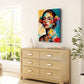 Modern bedroom with wooden dresser, colourful lady painting, and plant