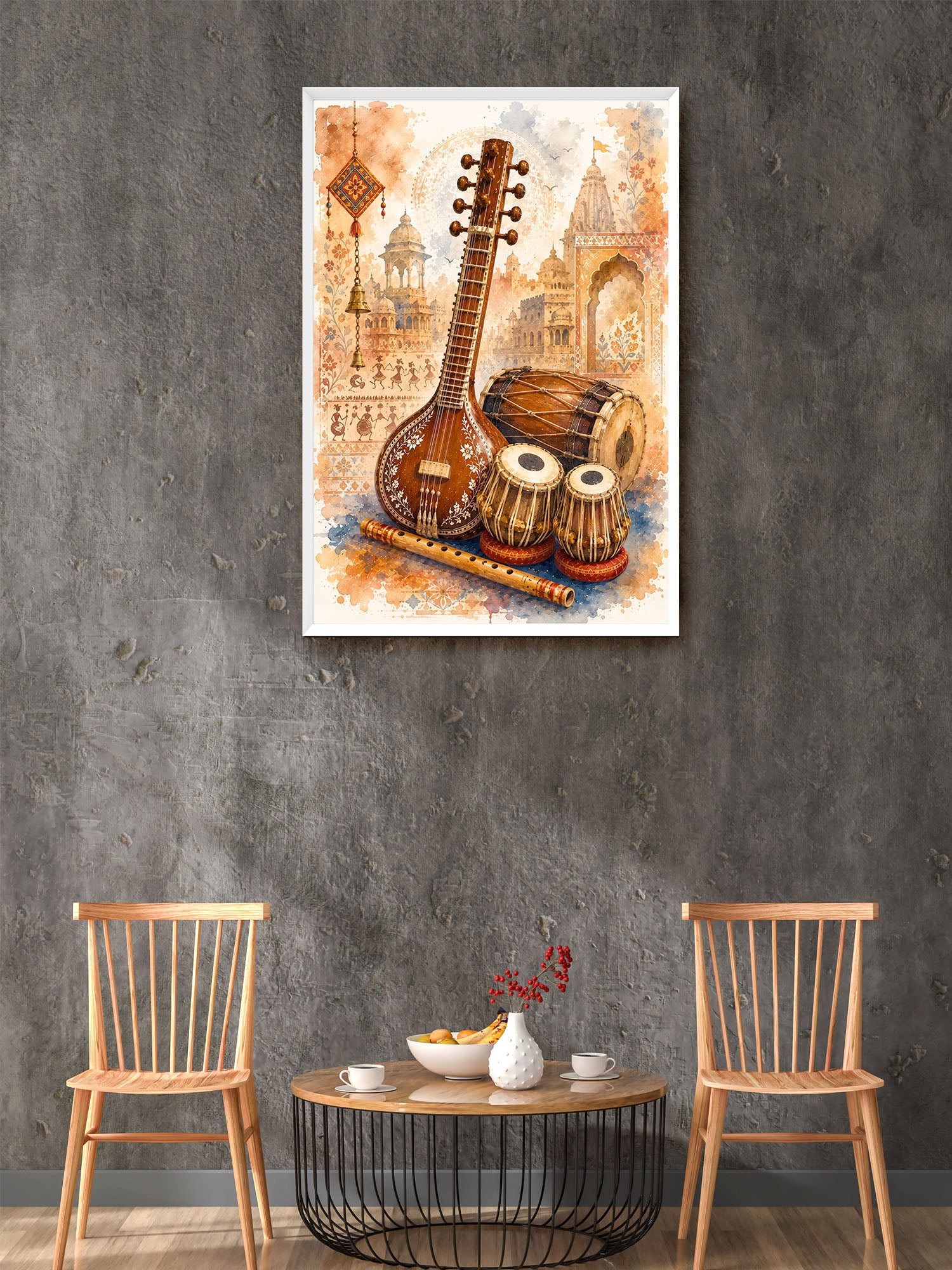 A framed wall art print featuring traditional Indian musical instruments, including a lute, tabla, and flute, displayed on a textured gray wall above a small round wooden table with two wooden chairs.