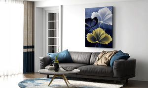 Living room with a gray sofa, coffee table, and floral artwork on the wall.