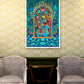 A colorful framed art print depicting a traditional Indian style illustration with a blue elephant and floral arch, displayed on a patterned wallpaper wall above a small table and two gray armchairs.