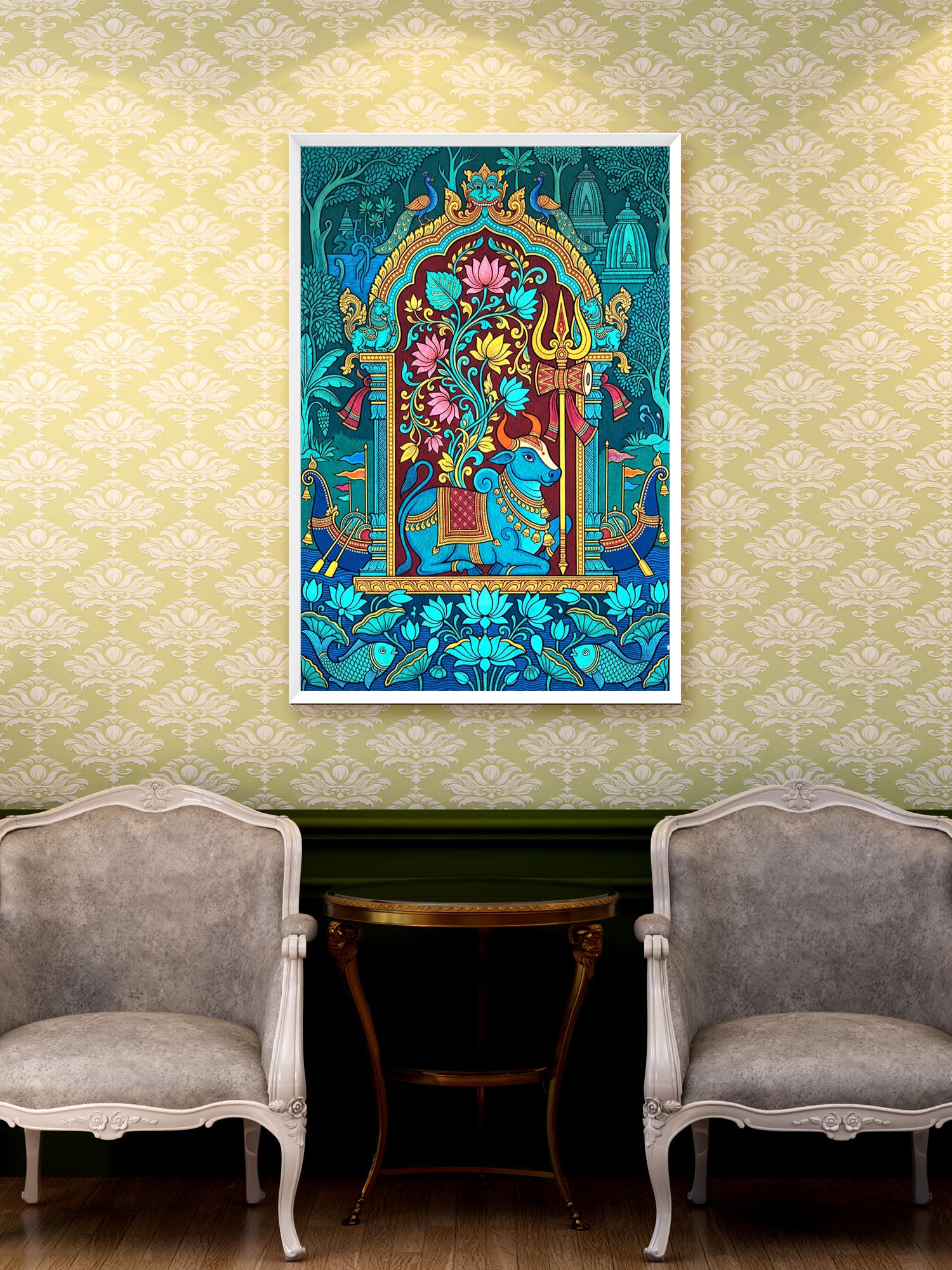 A colorful framed art print depicting a traditional Indian style illustration with a blue elephant and floral arch, displayed on a patterned wallpaper wall above a small table and two gray armchairs.