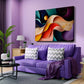 A colorful abstract canvas wall art print hangs on a lavender purple wall above a matching purple sofa in a modern living room setting.
