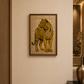 A framed art print of a golden tiger with black stripes on a textured beige background, hanging on a warm beige wall in a modern hallway.