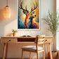 A colorful framed art print of a deer with large antlers hangs on a beige wall above a wooden desk and chair in a styled home office setting.