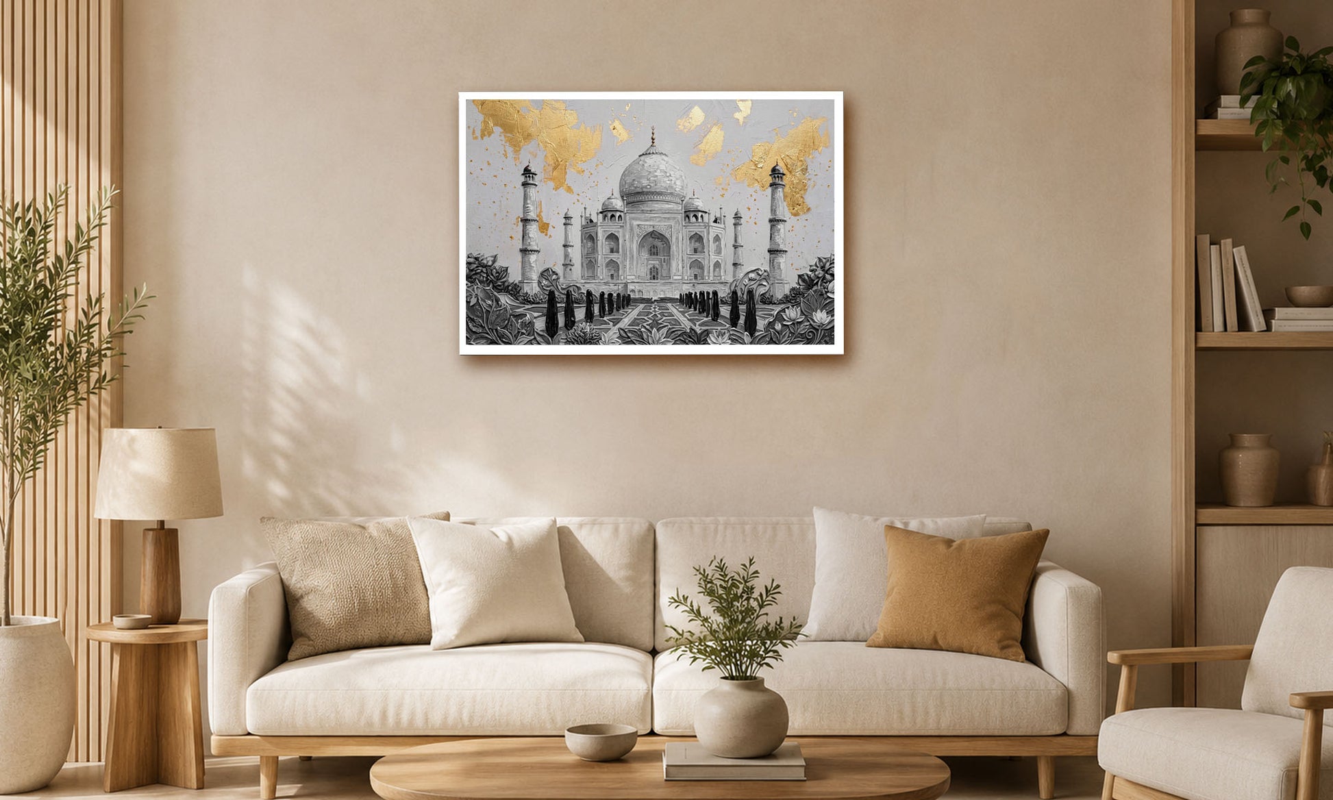 A framed art print of the Taj Mahal with gold leaf accents, displayed on a beige wall above a modern white sofa in a styled living room.