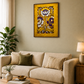 A framed vertical art print featuring a golden-yellow background with purple and white floral motifs, displayed on a beige wall above a cream-colored sofa in a styled living room.