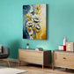 Living room with teal walls, gray chair, wooden side table, and floral painting.