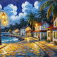 Coastal village canvas wall art featuring lantern-lit streets, tropical cottages, palm trees, and a scenic waterfront at dusk.