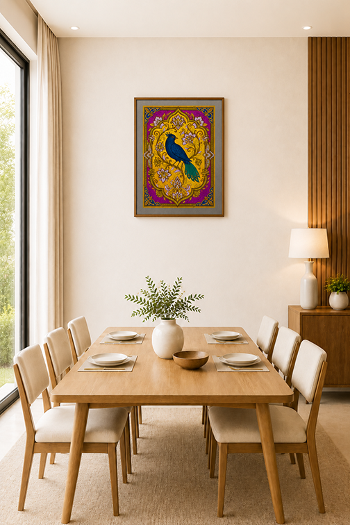 A framed art print featuring a vibrant peacock illustration in gold, purple, and blue, displayed on a beige wall in a modern dining room setting above a wooden dining table and chairs.