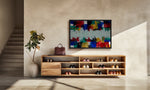 A modern wooden shoe cabinet with open shelves and drawers, styled in a minimalist entryway with a colorful abstract painting on the wall above it.