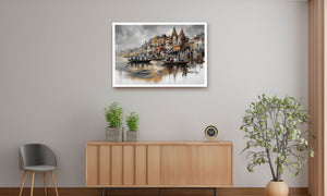 A framed art print depicting a scenic harbor with boats and buildings, displayed on a light gray wall above a wooden sideboard in a modern room setting.