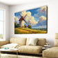 Living room with a beige sofa, armchair, and coffee table, featuring a large painting of a windmill on the wall.