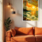 A framed art print of a Van Gogh-inspired swirling seascape with a bright yellow sun, displayed on a beige wall above an orange sofa in a modern living room setting.